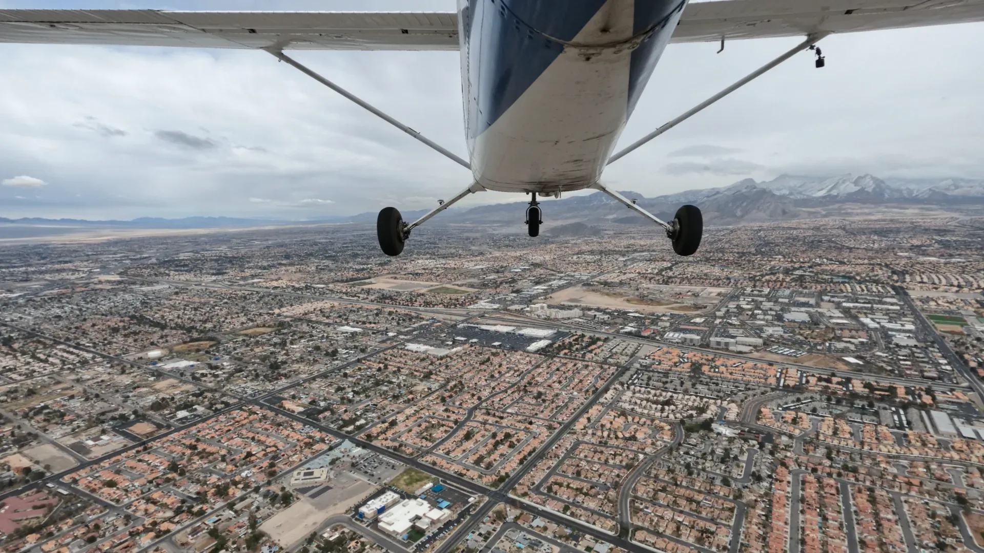 Airplane flying over city