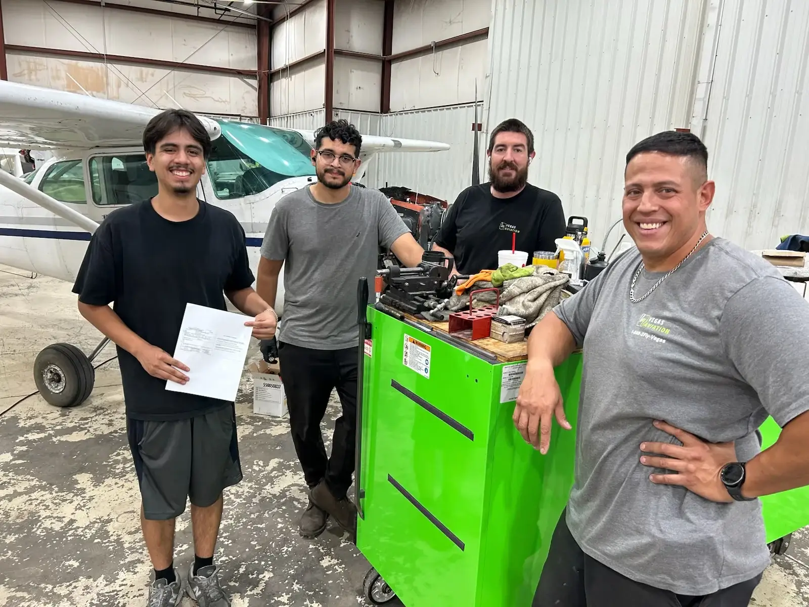 Vegas Aviation team celebrating Bryon's Airframe and Powerplant certification