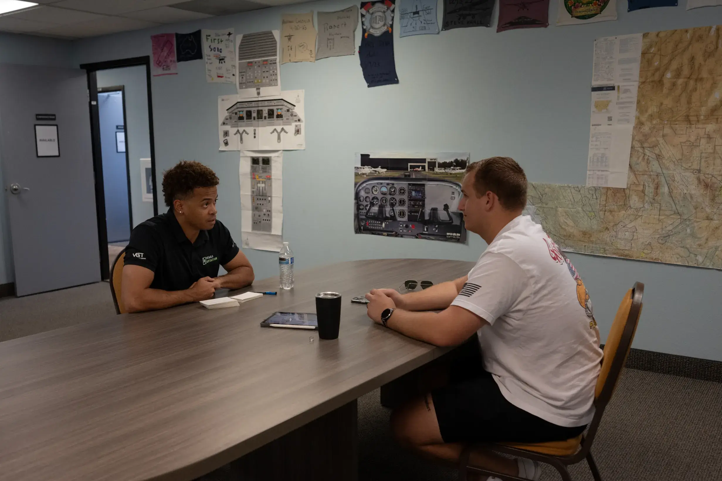 Vegas Aviation certified flight instructor briefing a student pilot beside the aircraft
