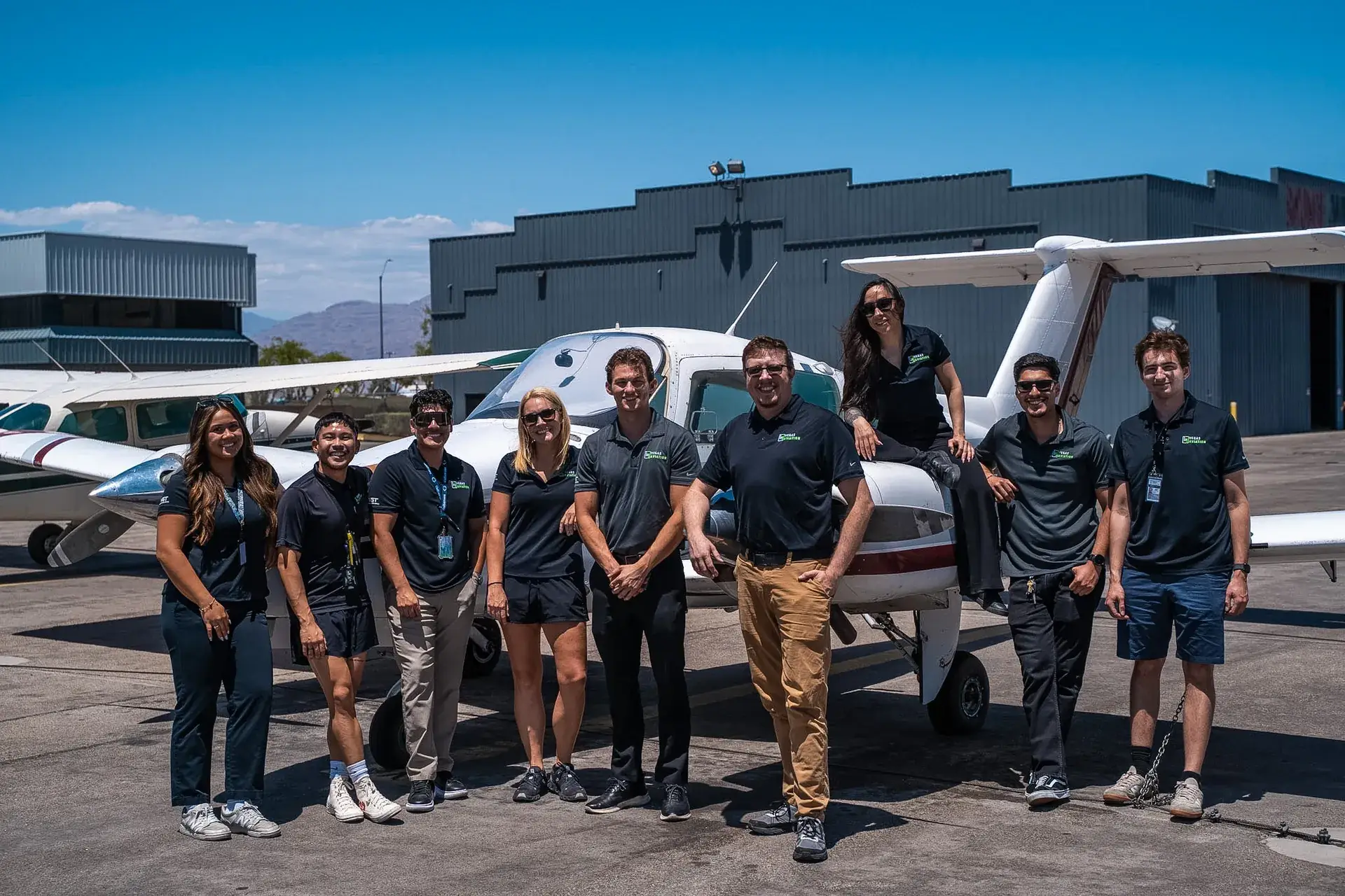 Vegas Aviation CFI team in front of a Beechcraft Duchess multi-engine aircraft
