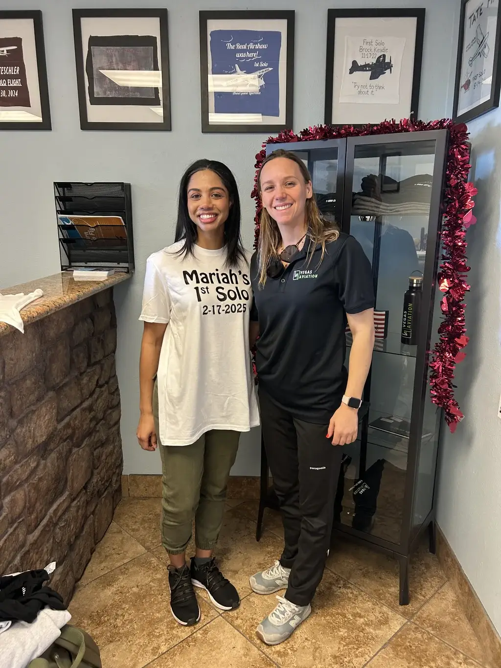 Mariah celebrating her first solo with her instructor