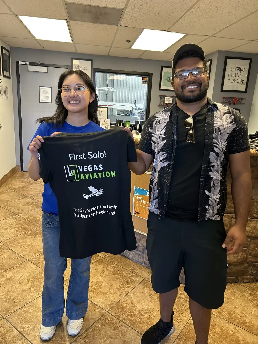 Student celebrating a first solo with a Vegas Aviation instructor
