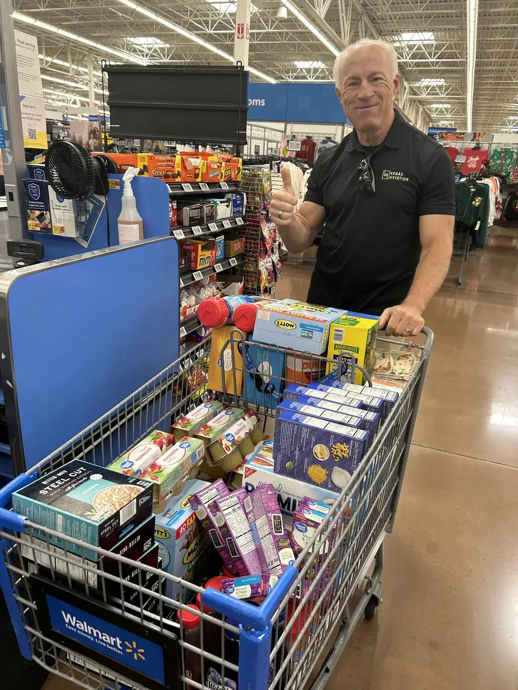 Shopping cart filled with community food donations