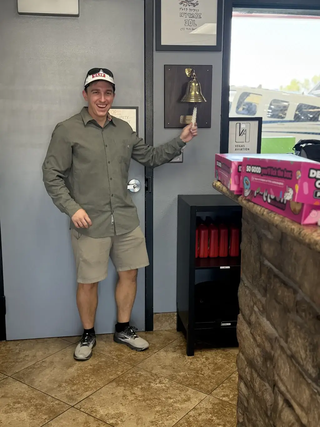 Vegas Aviation student ringing the bell after a checkride